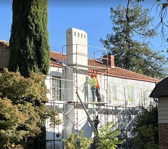 EIFS installation in progress on an Austin, TX home with scaffolding